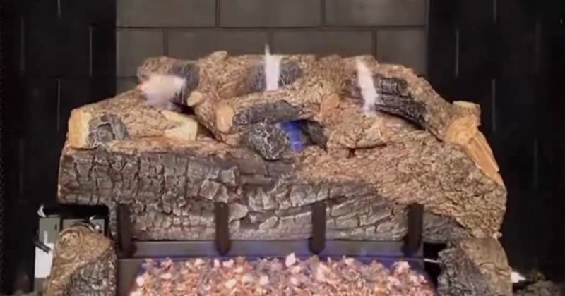Vail Premium hand-painted log set burning on a glowing ember bed